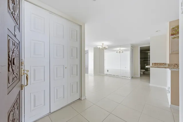 a view of a livingroom with furniture and an entryway