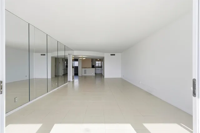 a view of a kitchen with a sink and cabinets