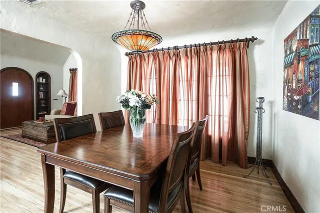 a view of a dining room with furniture and window