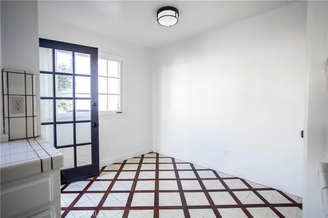 a kitchen with a stove a sink and a microwave