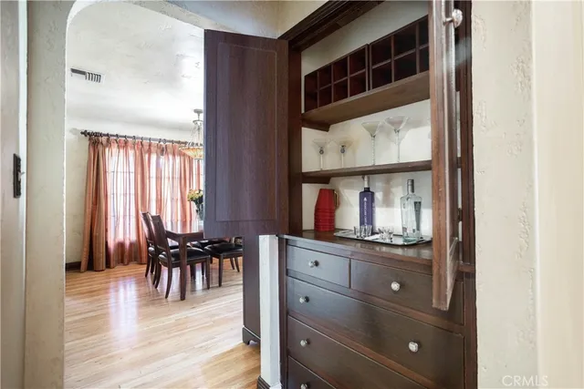 a bedroom with a bed a couch and a large window