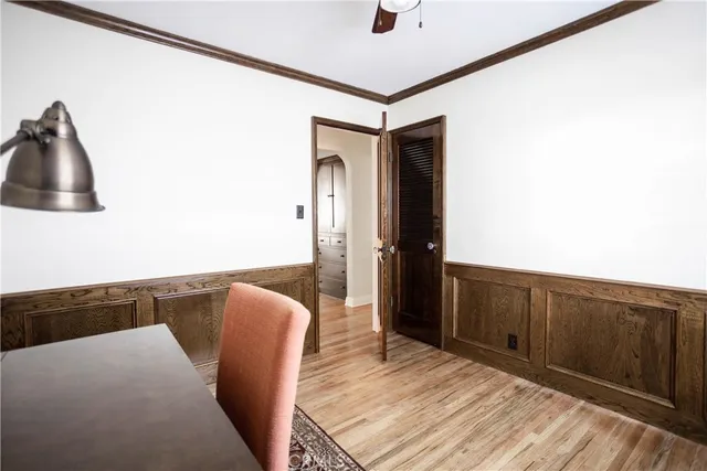a view of a porch with chairs and potted plants