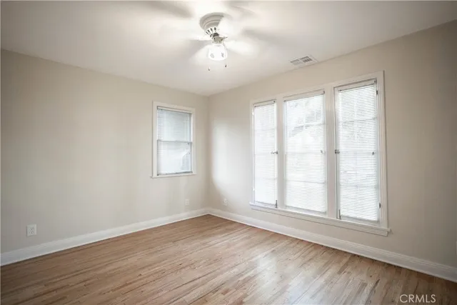 a view of a table and chairs in back yard of the house