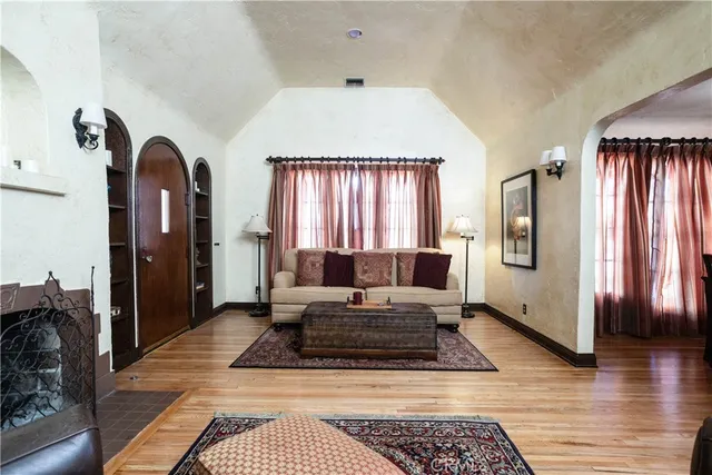 a living room with furniture fireplace and flat screen tv