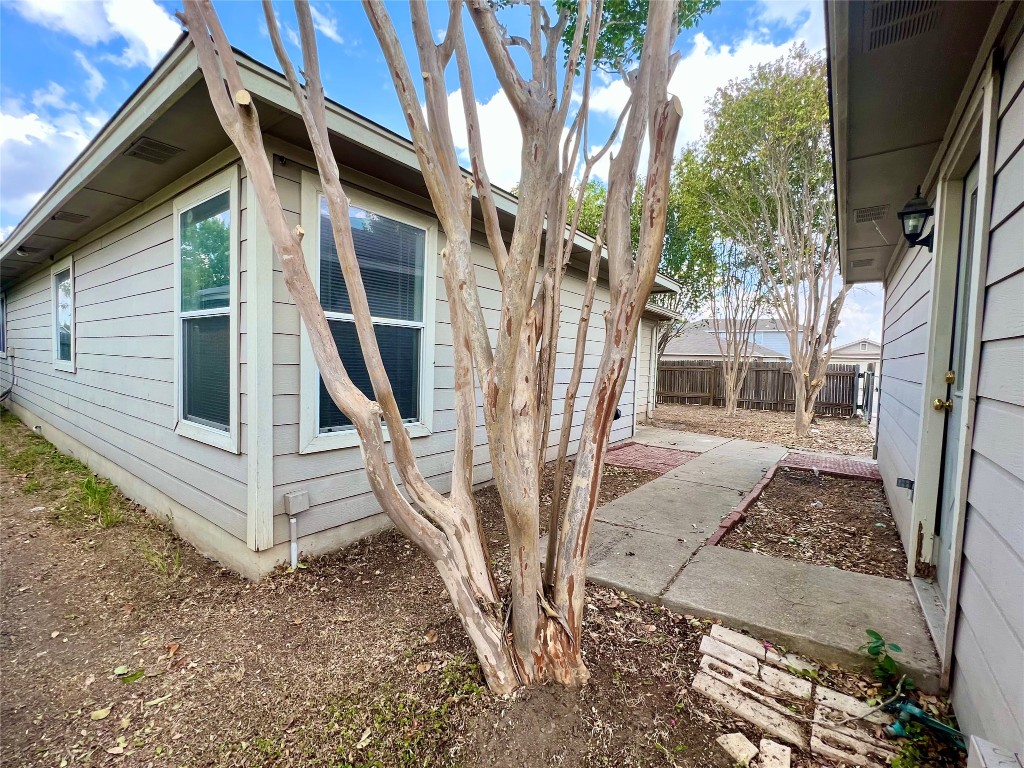 14200 Briarcreek Loop Manor, TX 78653 - Photo 13 of 20 a view of a house with backyard and wooden fence