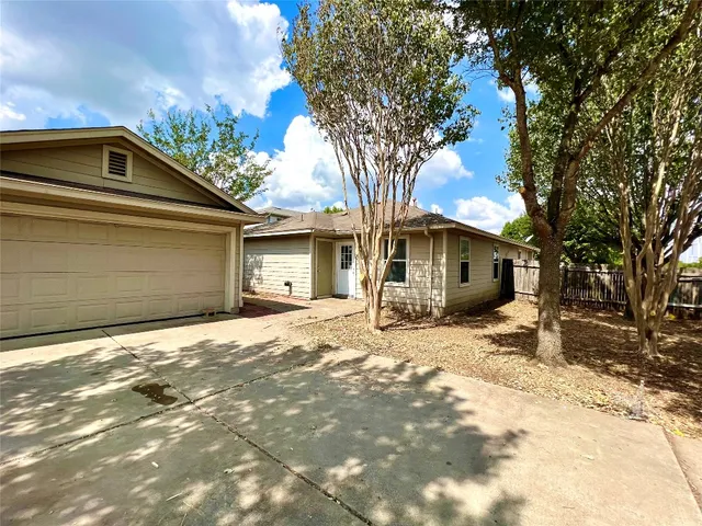 a house with trees in the background