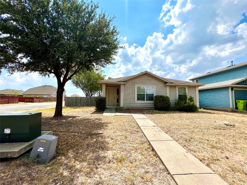 14200 Briarcreek Loop Manor, TX 78653 - Photo 17 of 20 a front view of a house with a yard