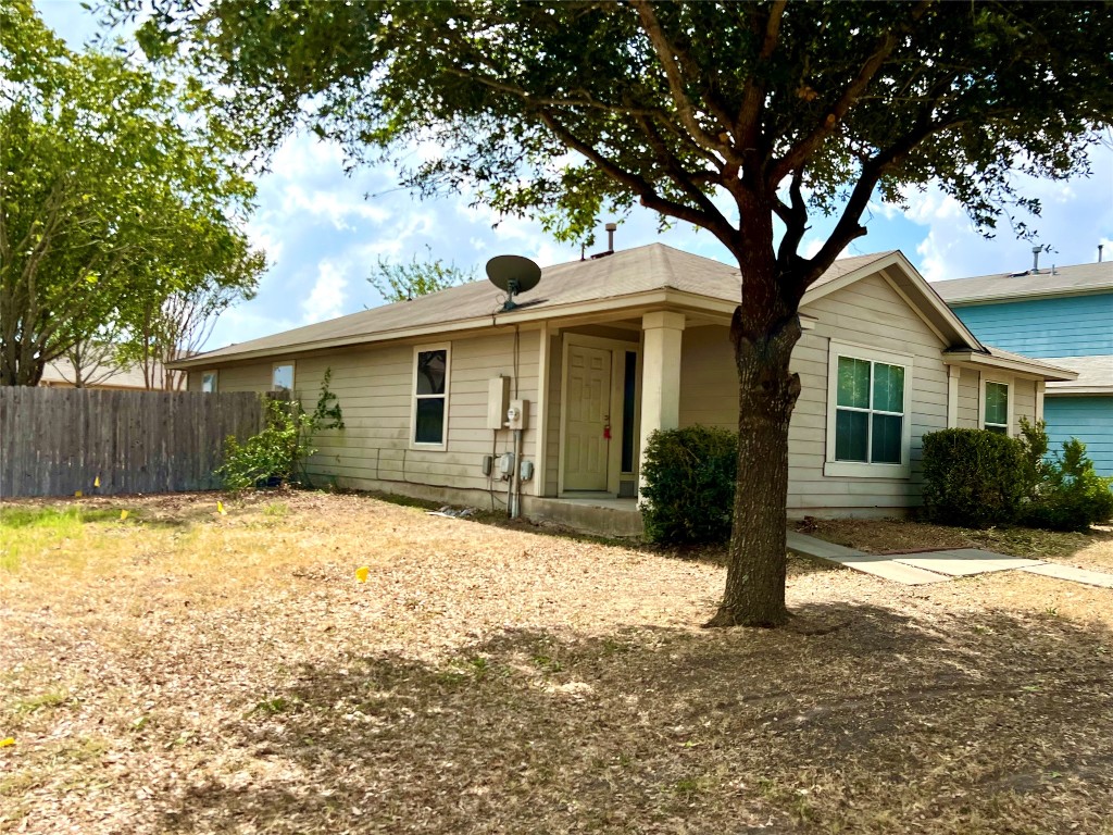 14200 Briarcreek Loop Manor, TX 78653 - Photo 19 of 20 a front view of a house with a yard and garage