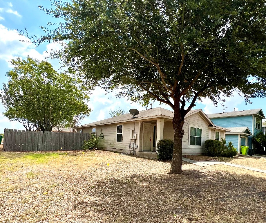 14200 Briarcreek Loop Manor, TX 78653 - Photo 20 of 20 a front view of a house with a yard and garage