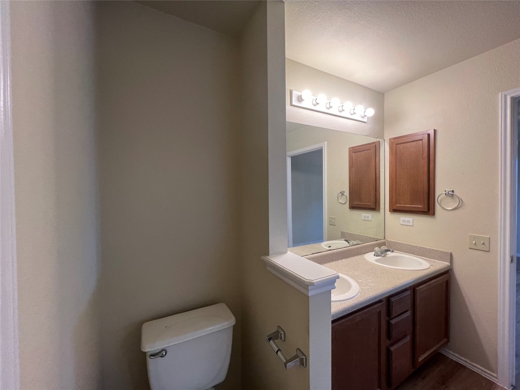 14200 Briarcreek Loop Manor, TX 78653 - Photo 9 of 20 a bathroom with a sink and a mirror
