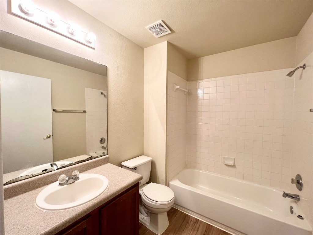 14200 Briarcreek Loop Manor, TX 78653 - Photo 10 of 20 a bathroom with a sink a toilet and a bathtub