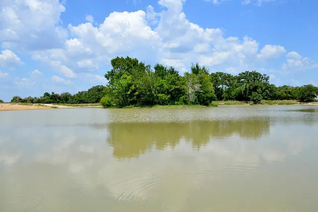 a view of a lake with a big yard