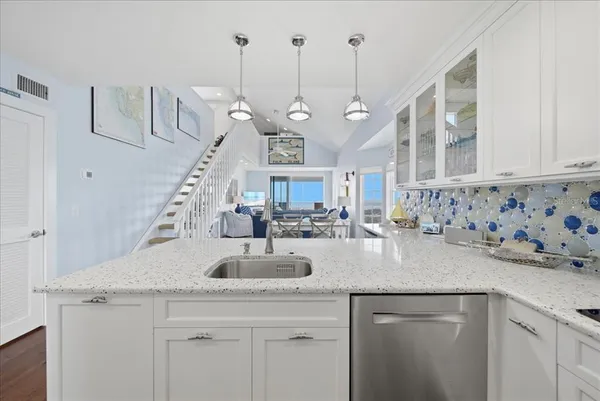 a kitchen with a table and chairs