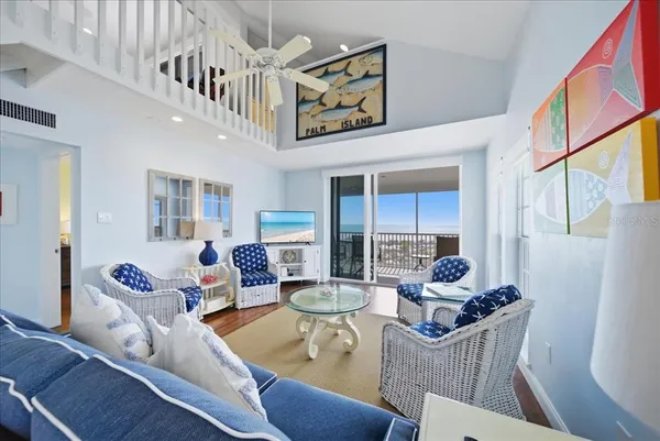 a bedroom with a bed and a flat tv screen on dresser