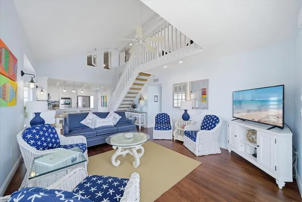 a bathroom with a bathtub a double vanity sink and mirror