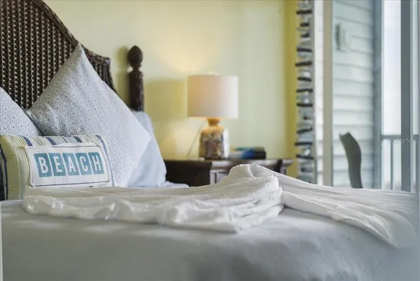 a hallway with couches and wooden floor