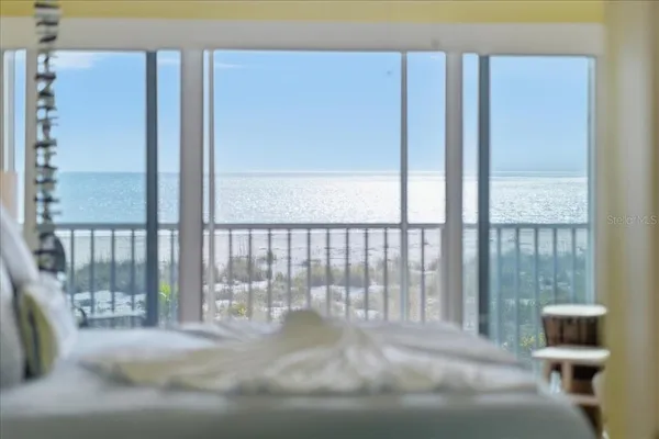 a view of kitchen with furniture and wooden floor