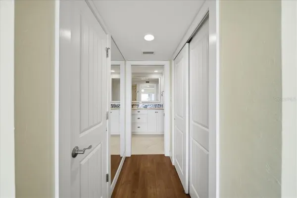 a view of a kitchen with a sink and cabinets