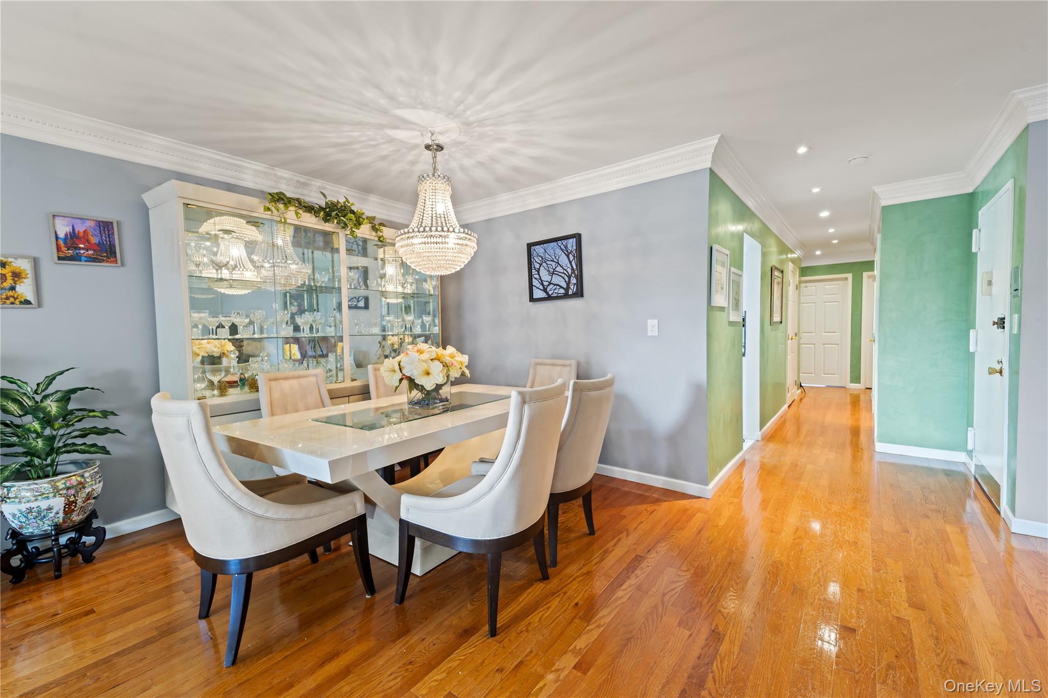 12-35 Robin Lane, Unit UPPR Queens, NY 11360 - Photo 4 of 23 Dining space with light wood-style flooring, crown molding, a chandelier, and recessed lighting