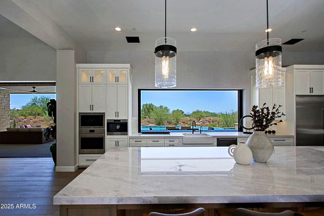 a living room with couch and a wooden floor