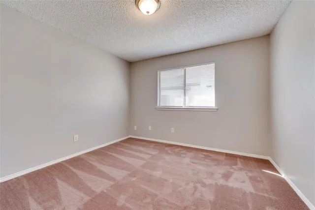 a bathroom with a granite countertop sink a toilet and bathtub