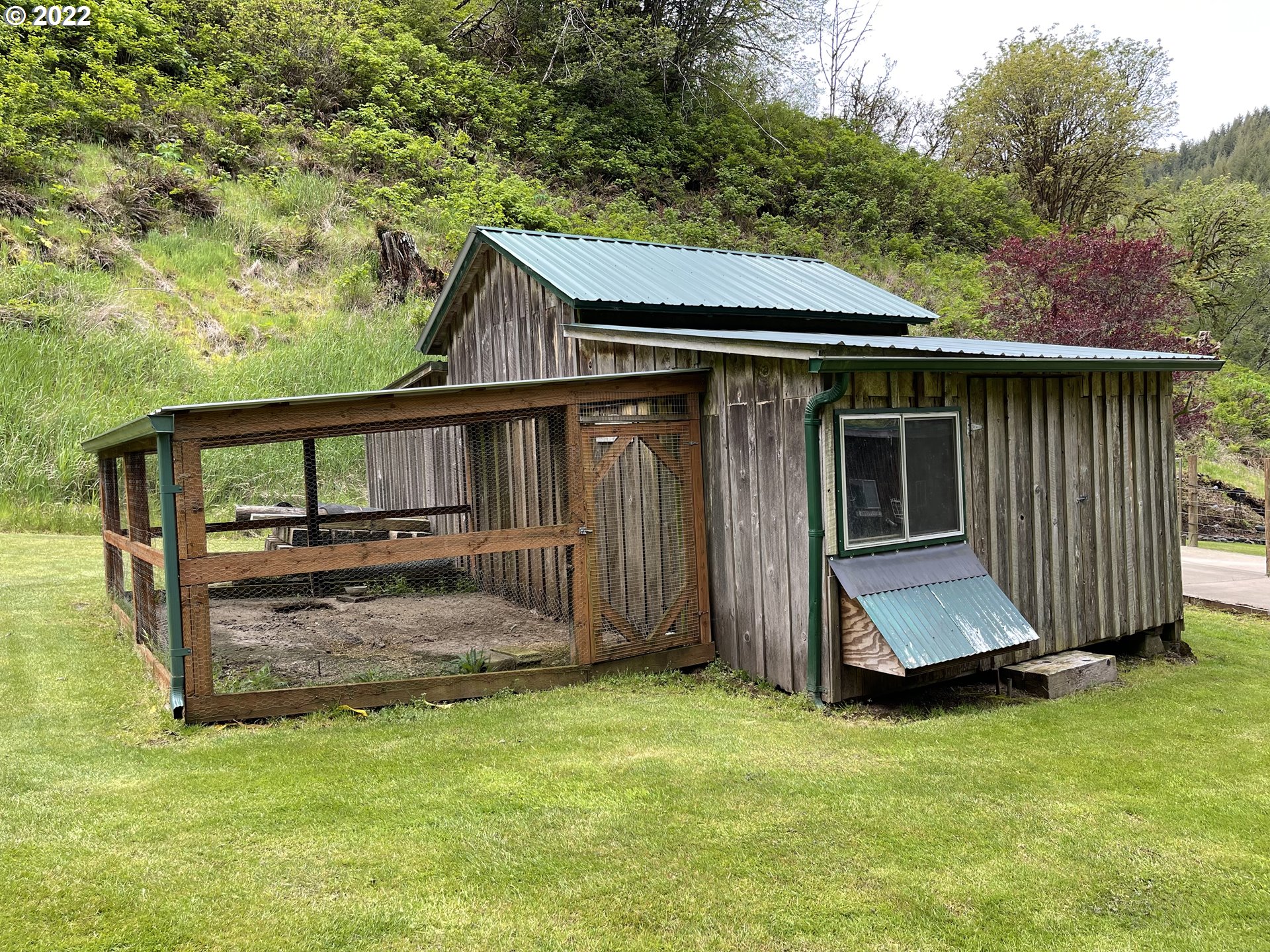 1891 Oar Creek Road Reedsport, OR 97467 - Photo 12 of 31 a view of house with backyard and deck