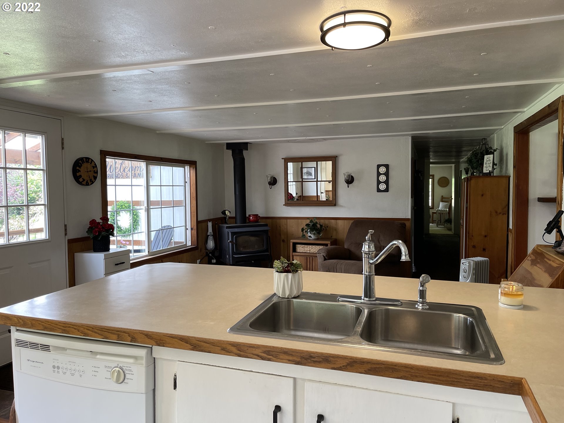 1891 Oar Creek Road Reedsport, OR 97467 - Photo 25 of 31 a kitchen with a sink and a large window