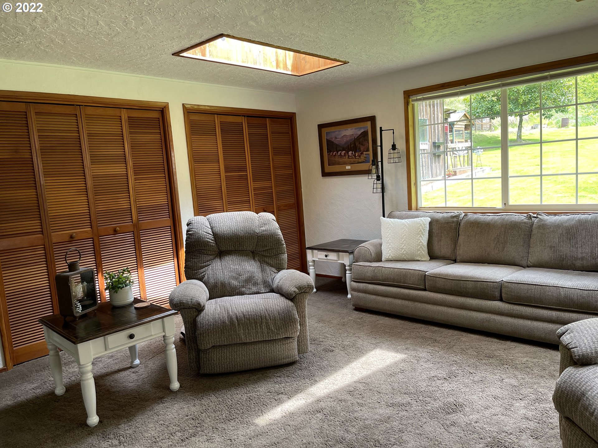 1891 Oar Creek Road Reedsport, OR 97467 - Photo 29 of 31 a living room with furniture and a large window