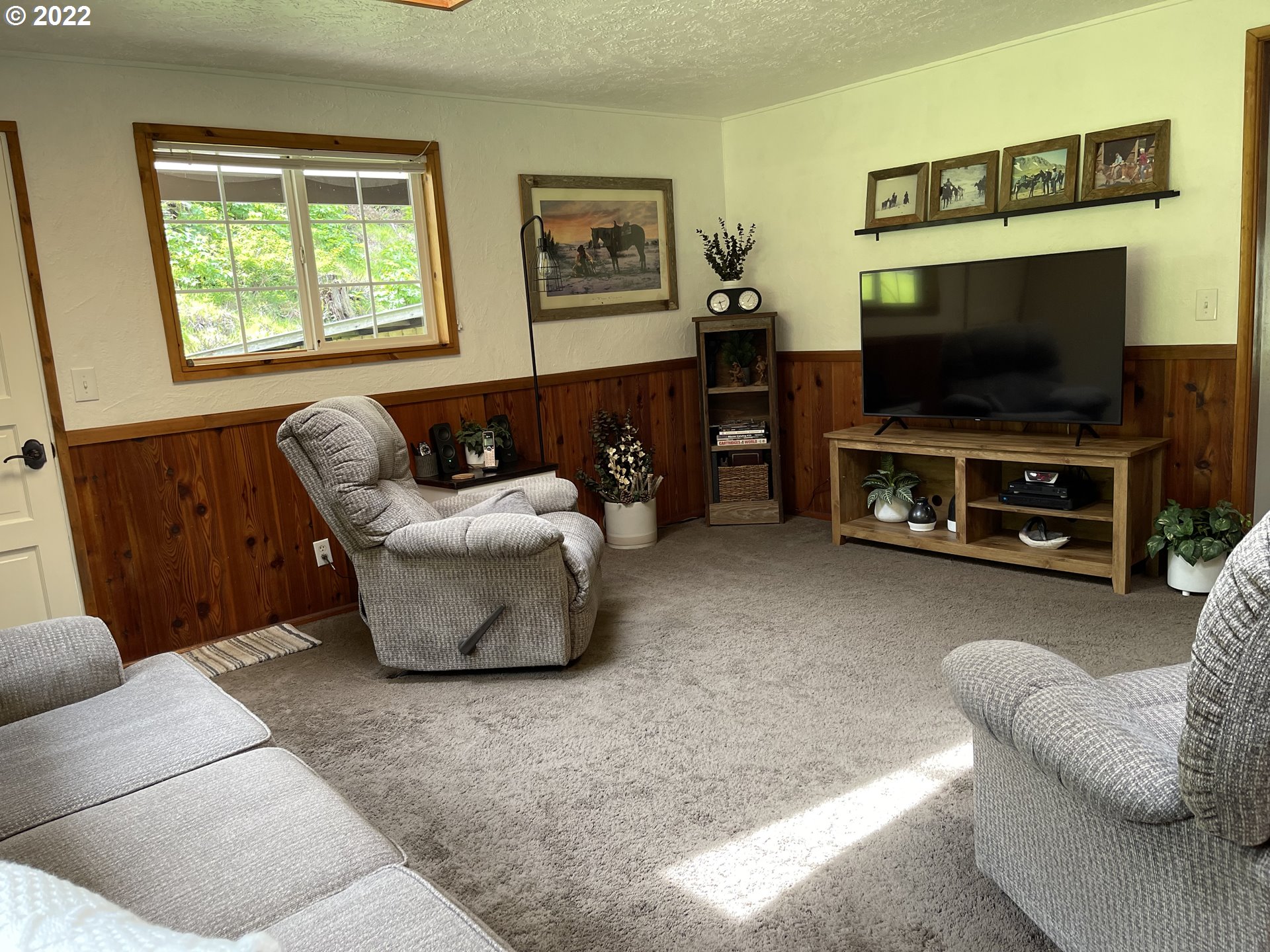 1891 Oar Creek Road Reedsport, OR 97467 - Photo 30 of 31 a living room with furniture and a flat screen tv
