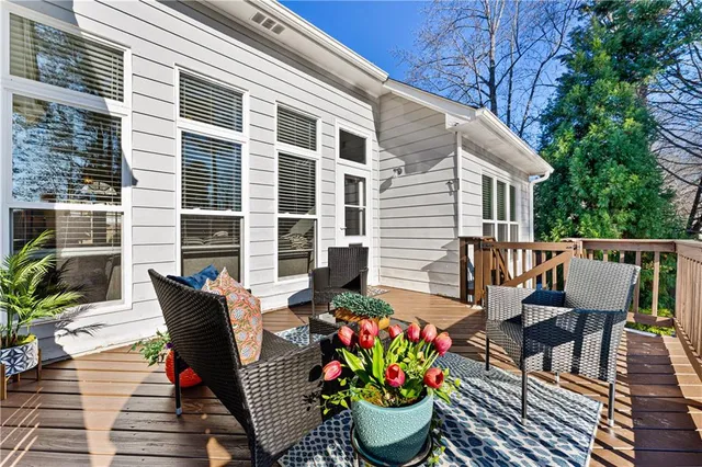 a view of a chair and table on the deck