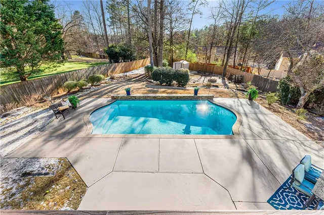 a view of swimming pool from a balcony
