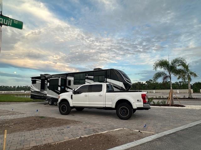 9001 Gasparilla Road, Unit 59 Placida, FL 33947 - Photo 15 of 77 a view of a car parked in front of a house