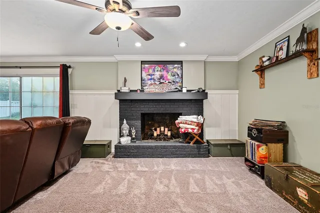 a dining room with furniture a chandelier and window
