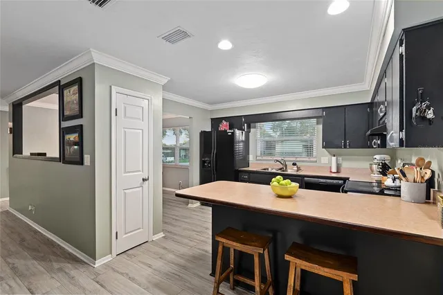 a bathroom with a granite countertop toilet sink and mirror
