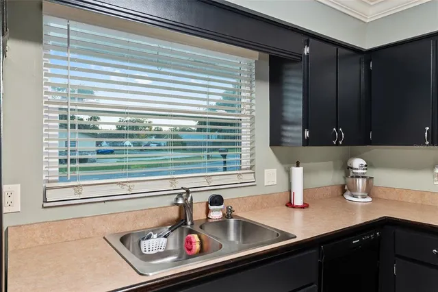 a view of a storage and utility room with washer and dryer