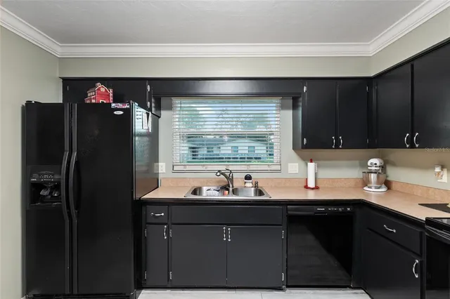 a view of a backyard with a garden and entertaining space