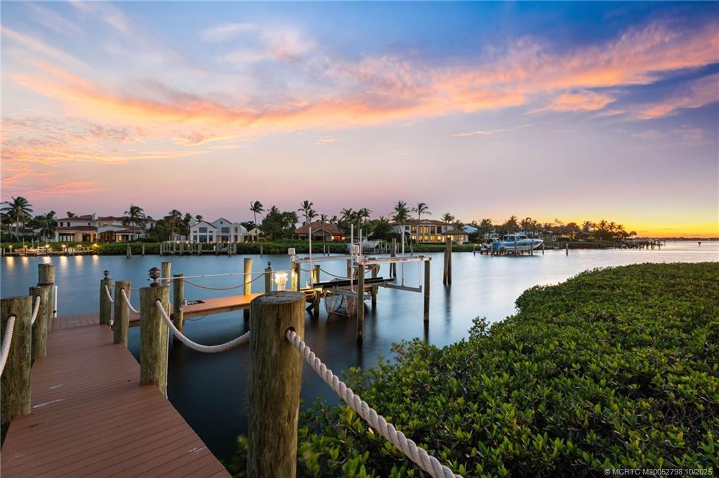 2440 Bahia Way Stuart, FL 34996 - Photo 14 of 67 a view of a lake with a terrace