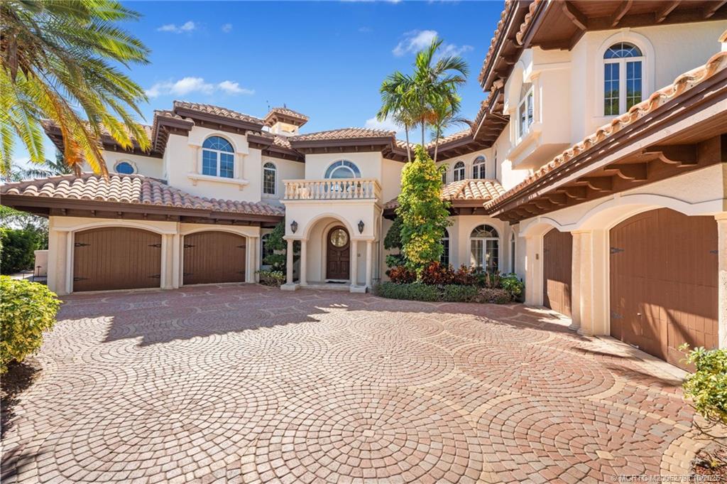 2440 Bahia Way Stuart, FL 34996 - Photo 21 of 67 a front view of a building with parking space