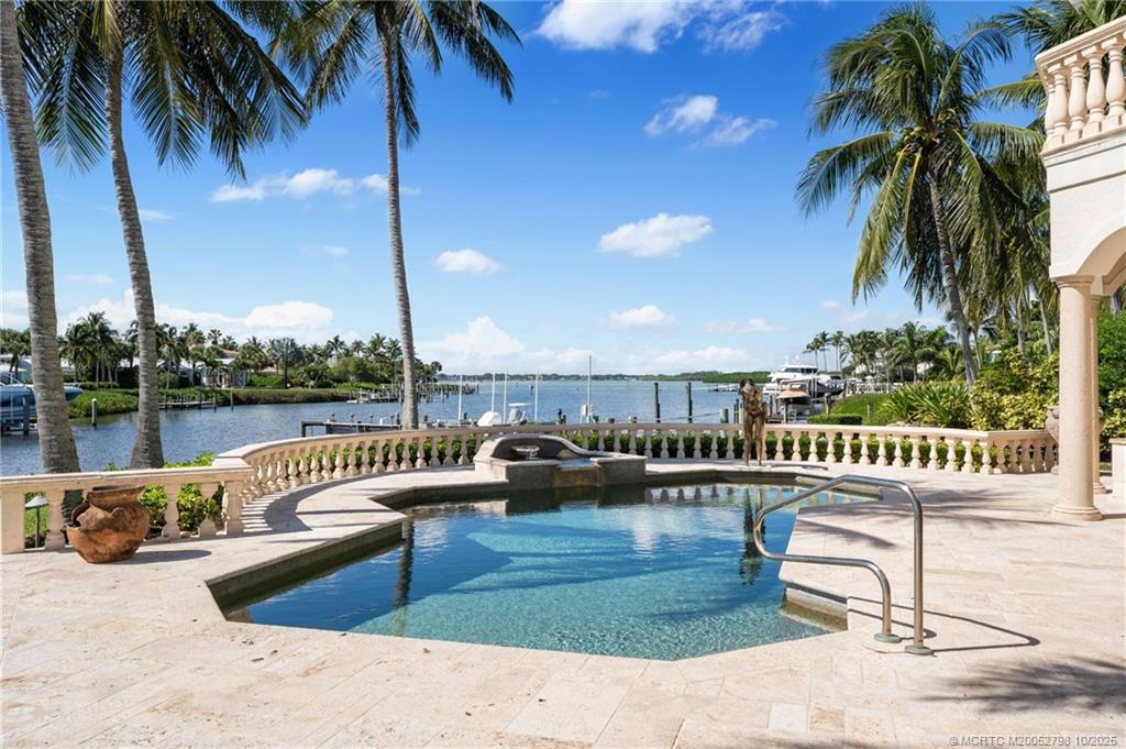 2440 Bahia Way Stuart, FL 34996 - Photo 26 of 67 a view of a lake with couches chairs
