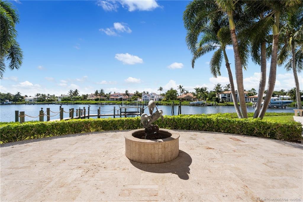 2440 Bahia Way Stuart, FL 34996 - Photo 29 of 67 a view of a lake with a garden