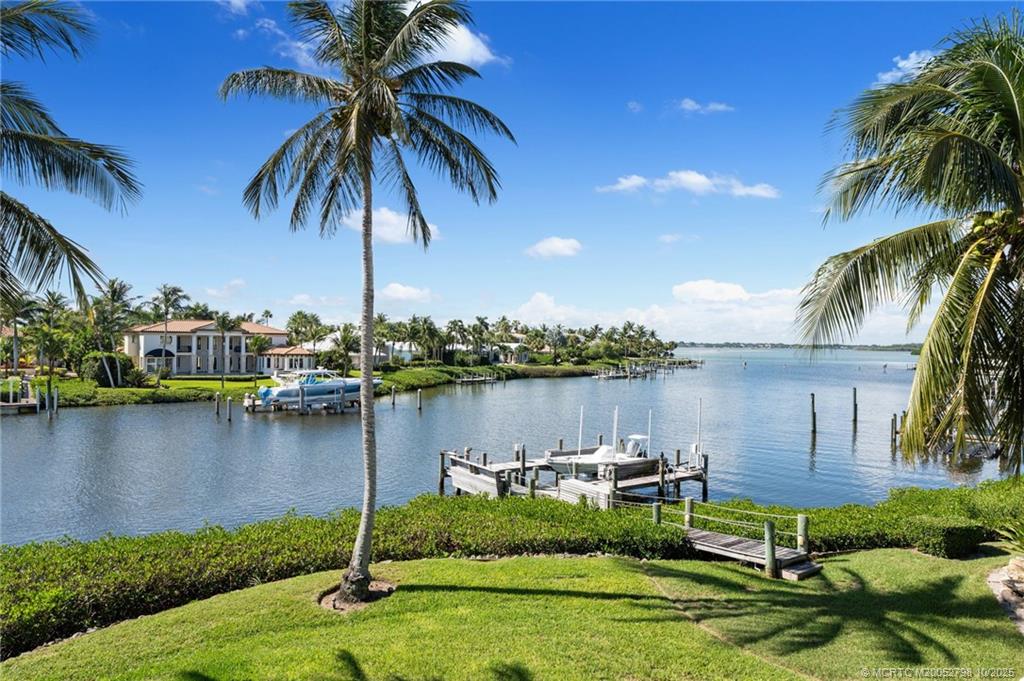 2440 Bahia Way Stuart, FL 34996 - Photo 30 of 67 a view of a lake with a house