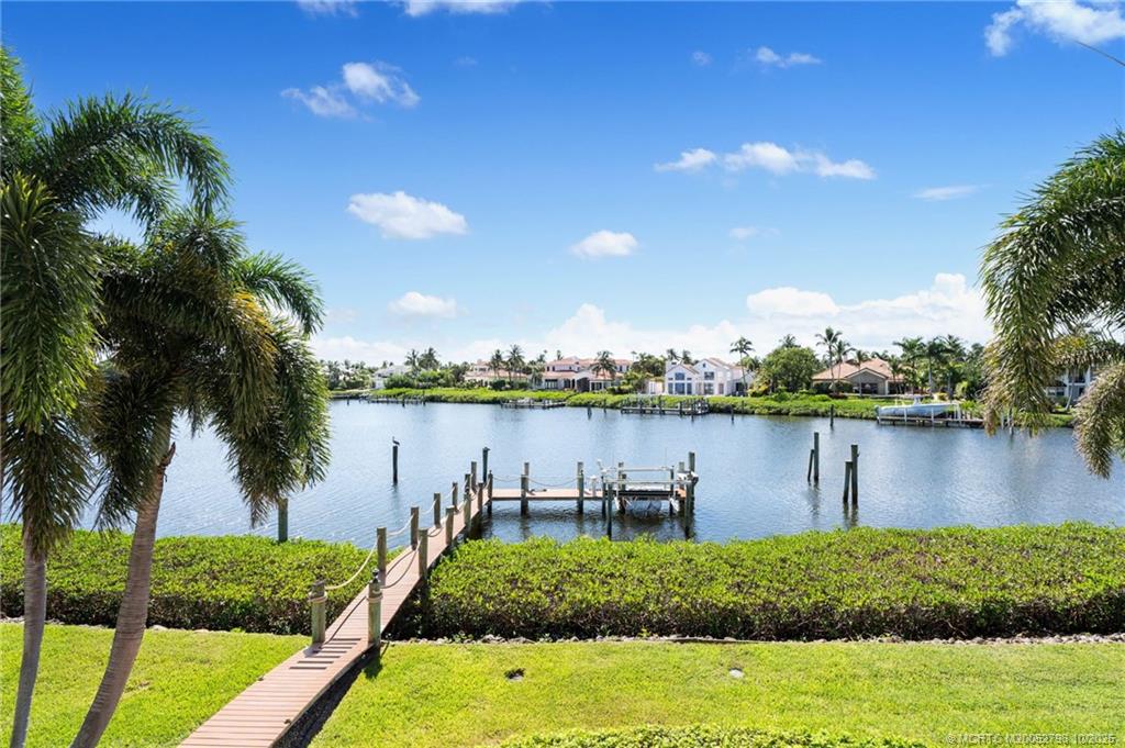 2440 Bahia Way Stuart, FL 34996 - Photo 31 of 67 a view of a lake from a yard