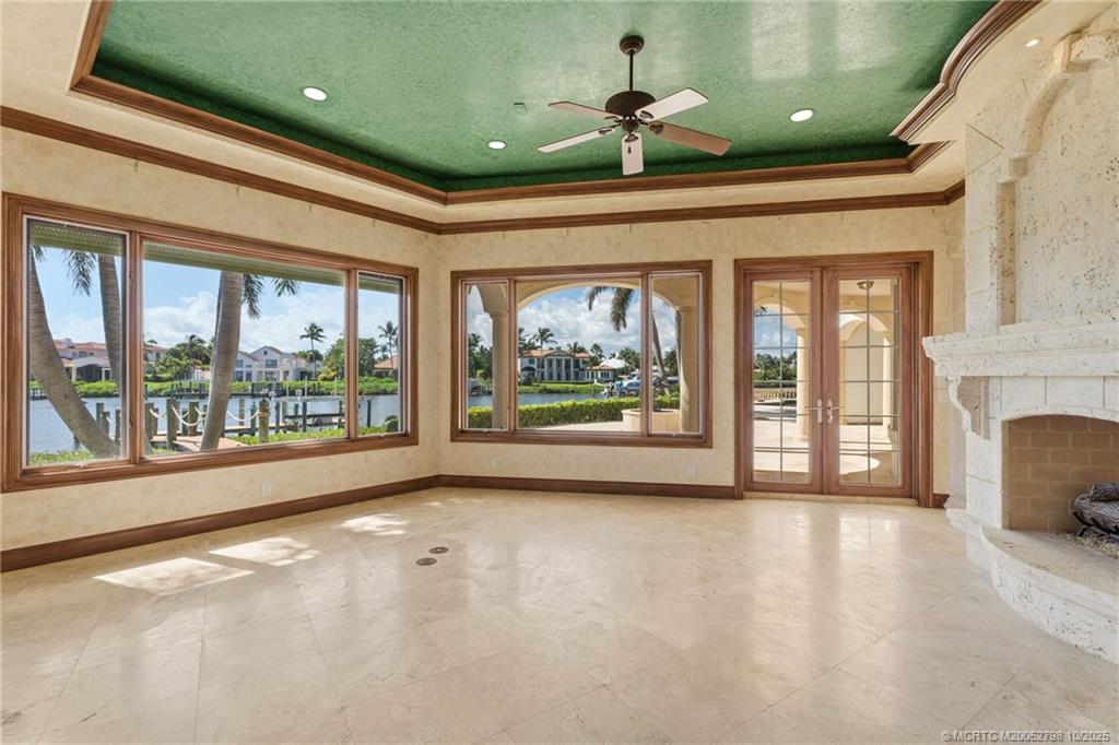 2440 Bahia Way Stuart, FL 34996 - Photo 38 of 67 a view of an empty room with a fireplace and a window
