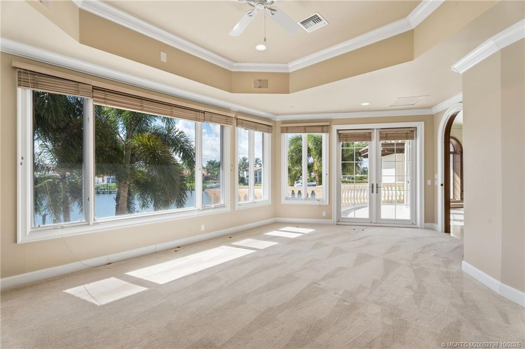 2440 Bahia Way Stuart, FL 34996 - Photo 43 of 67 a view of an entryway with a floor to ceiling window and a ceiling fan