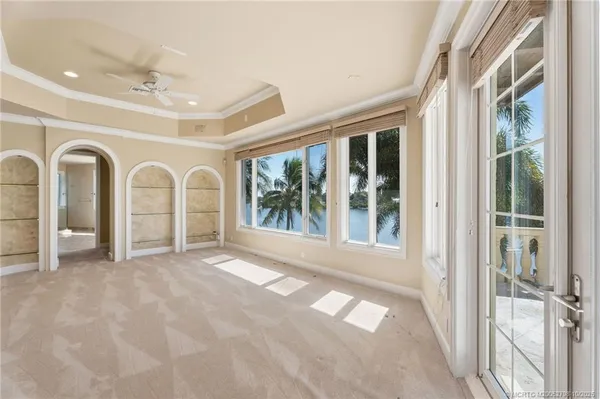 an aerial view of a city with lots of residential buildings lake and ocean view