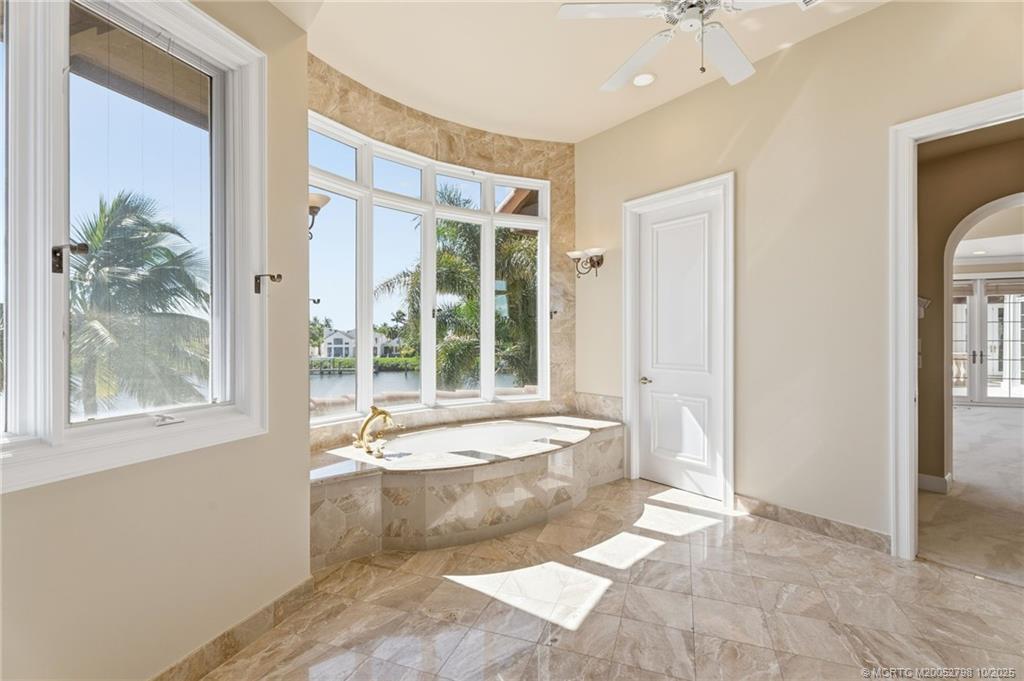 2440 Bahia Way Stuart, FL 34996 - Photo 46 of 67 a spacious bathroom with a tub and shower