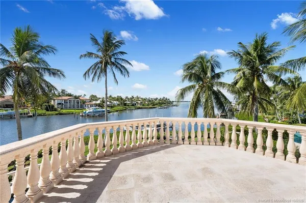 an aerial view of a house with a lake view