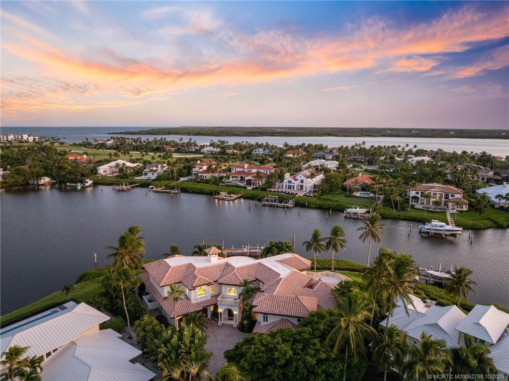 2440 Bahia Way Stuart, FL 34996 - Photo 5 of 67 an aerial view of lake and city