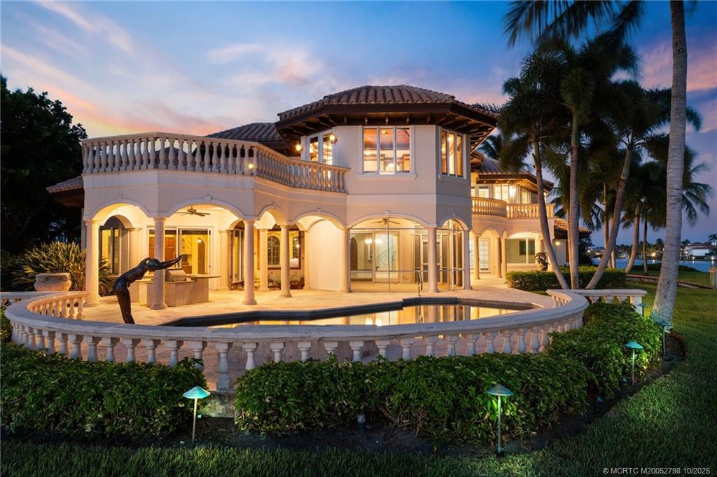 2440 Bahia Way Stuart, FL 34996 - Photo 8 of 67 a swimming pool with outdoor seating and yard