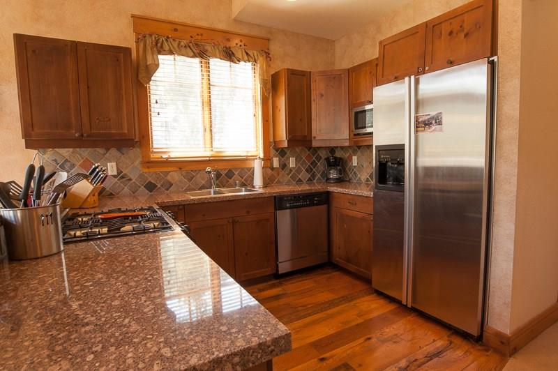 188 Tip Top Trail, Unit 6559 Keystone, CO 80435 - Photo 10 of 24 a kitchen with a sink a refrigerator and cabinets